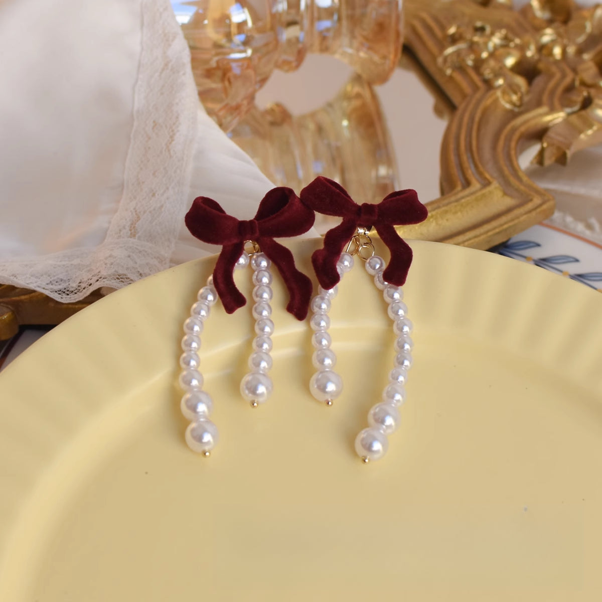 Burgundy Velvet Bow Pearl Drop Earrings - Front view