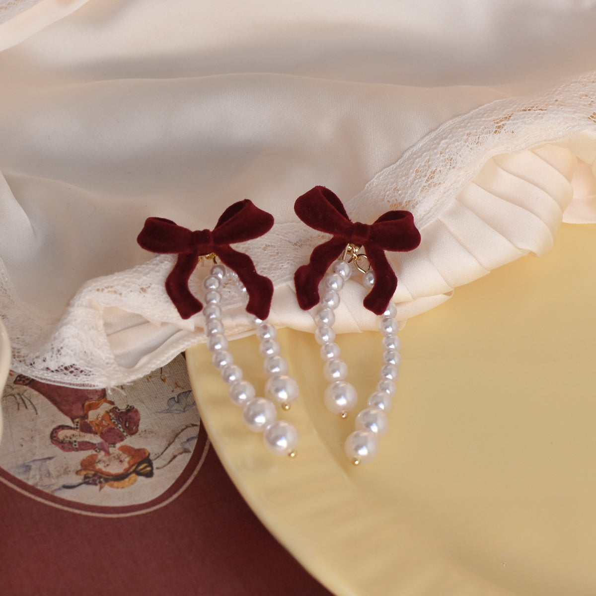 Burgundy velvet pearl earrings paired