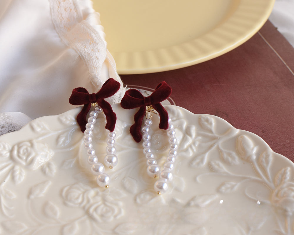 Elegant Burgundy Velvet Bow & Pearl Earrings isolated